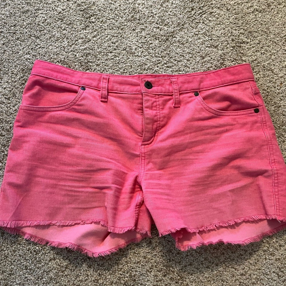 Super cute but too small for me now :(.  The color is coral pink. Great brand